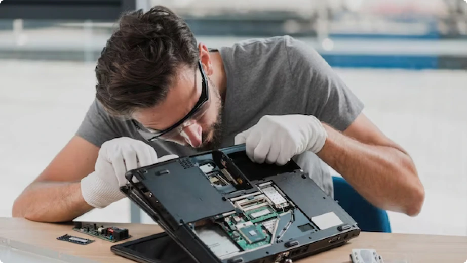 Professional carefully repairing a laptop